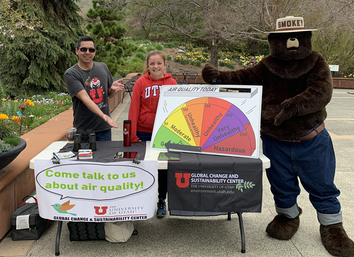 Raul Ochoa (left) and Mikala Jordan (center) with Smokey the bear at Arbor Day Celebration at Red Butte Gardens."