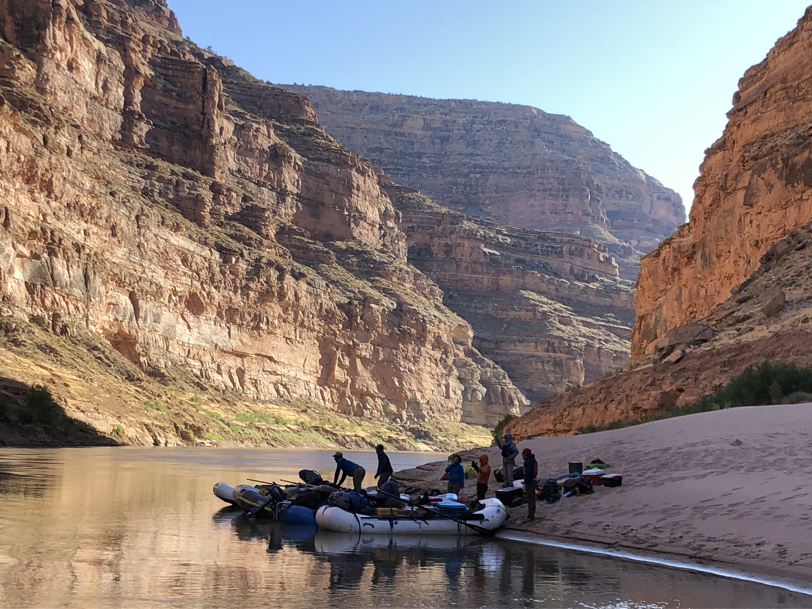researchers load rafts in preparation to float the canyon river