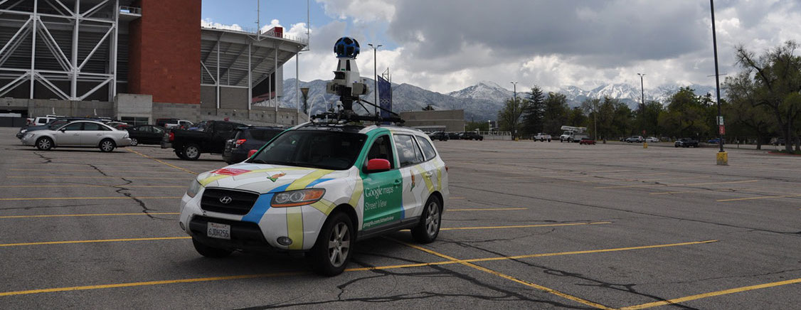 A Google car with atmospheric gas measuring instrumentation is in the University of Utah stadium parking lot.